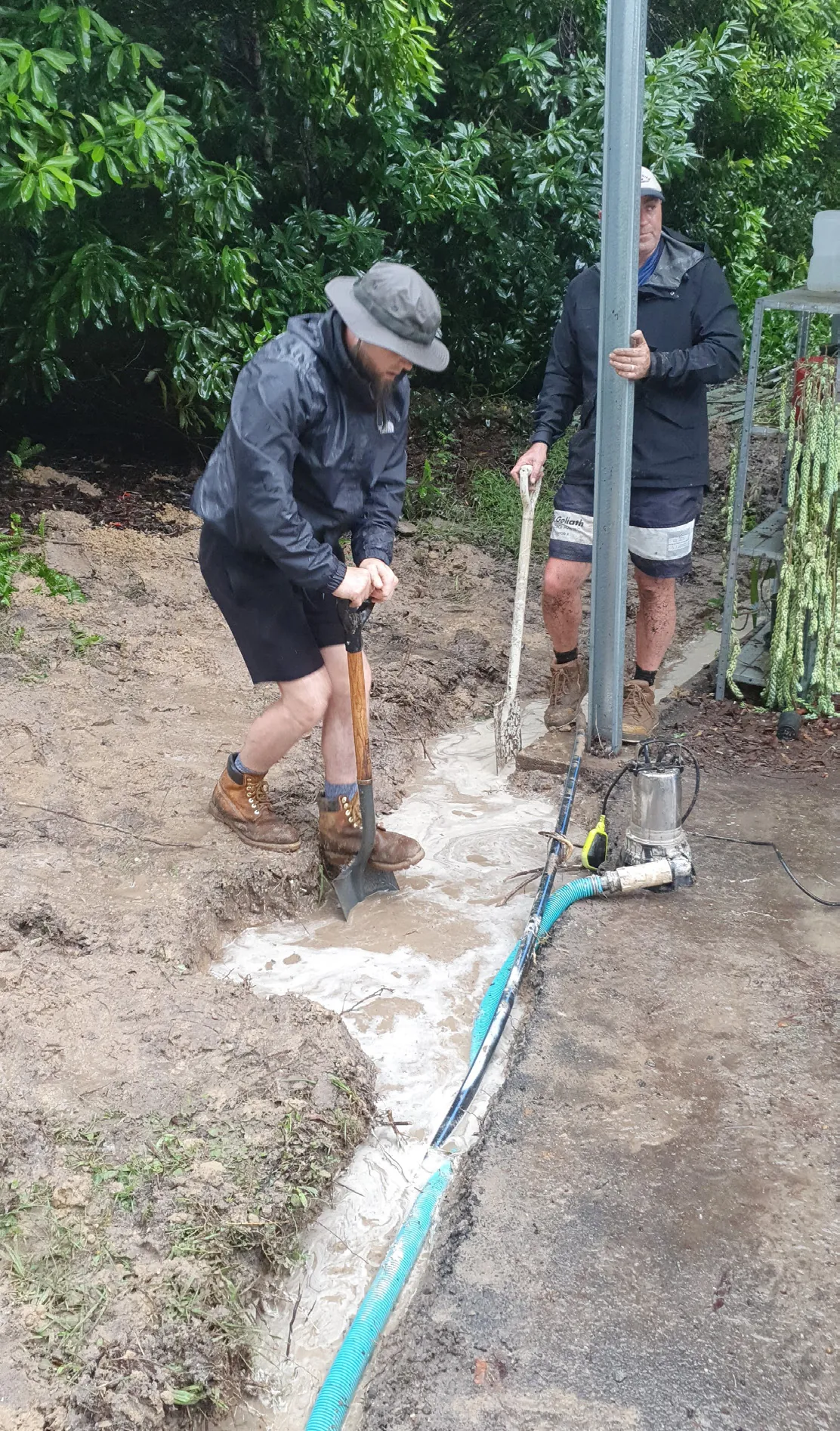 Mark Lysaght digging a trench at the flooded NET offices