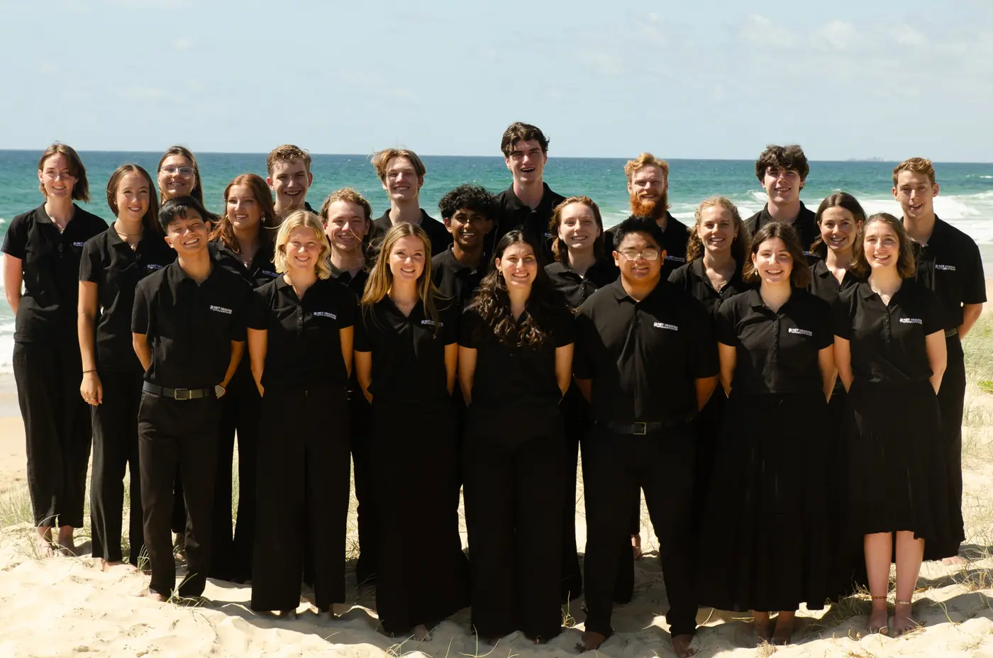 NET missionaries gathered on the beach in 2025