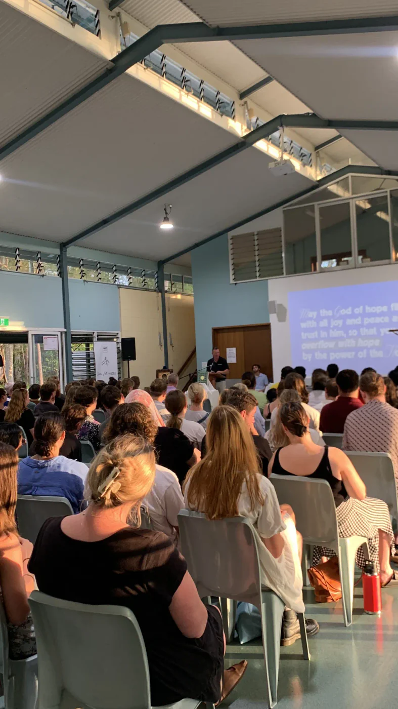 A full hall listening, with song lyrics on the screen